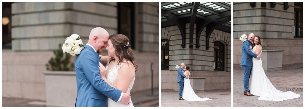 A couple embraces under the awning of Denver union station for a Denver photographer